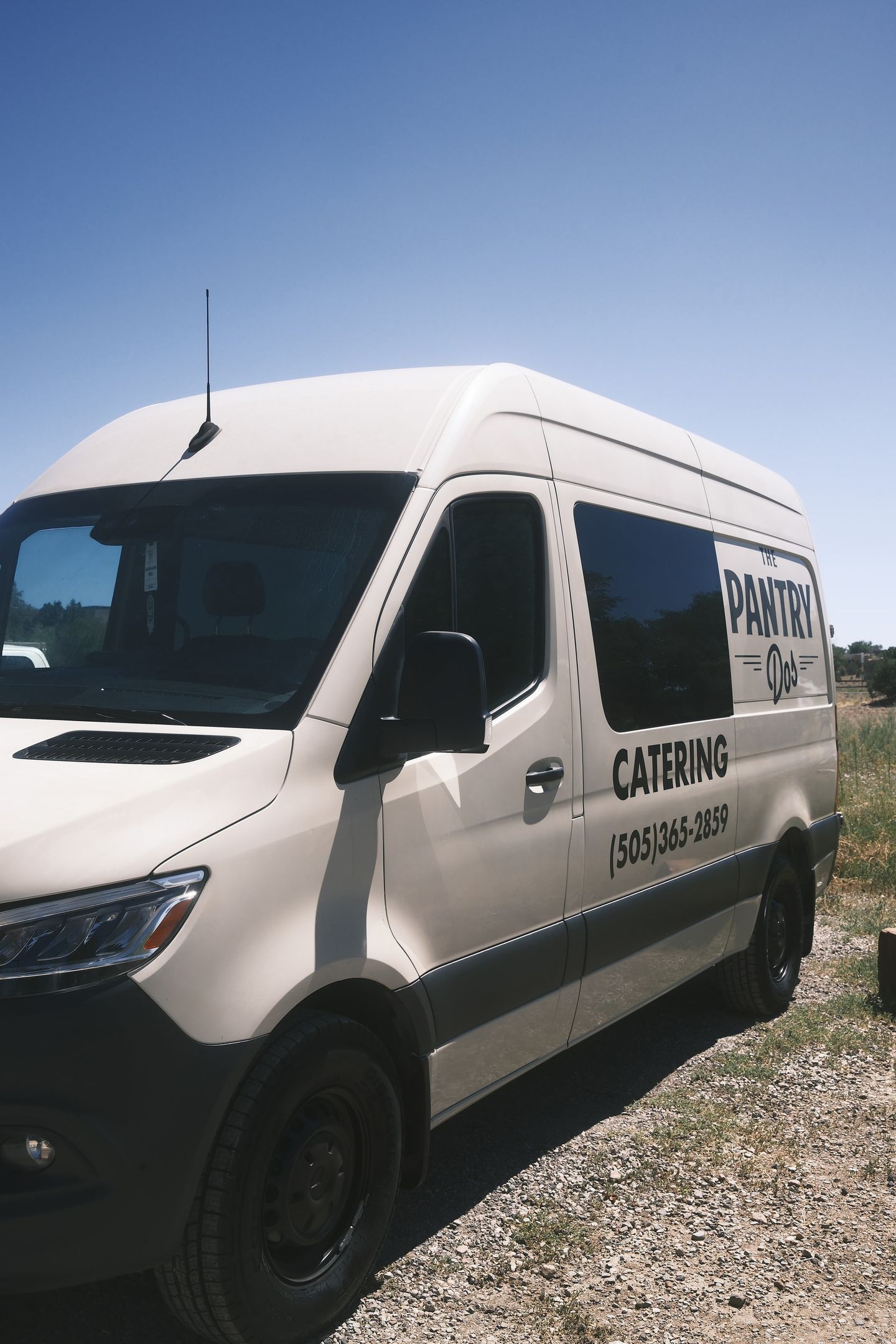 The Pantry Catering van, ready to head out under a blue Santa Fe sky
